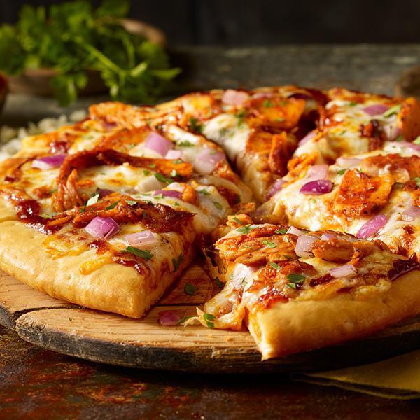 Barbecue-glazed Blackened Chicken Pizza · Thick crust pizza, lightly brushed with honey butter and topped with sweet barbecue-glazed blackened chicken, grilled red onion, Monterrey Jack cheese, cilantro.