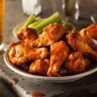 Chicken Wings · 10 pieces. Hot sauce or BBQ sauce.