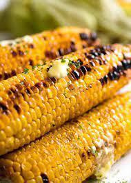 Grilled Corn · Grilled corn on the cob with chili powder, Cotija cheese and chipotle mayo. Vegetarian.