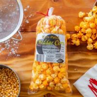 Cheddar Popcorn · Savory flavor, hybrid corn with yellow cheddar flavoring. Get ready for orange stained finge...