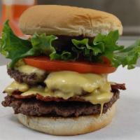 The Carnage Burger · Our double meat, double cheeseburger with bacon, lettuce, tomato, pickles, onion, cheese, mu...