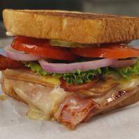 Everett Melt · Turkey, Ham, melted Swiss and American Cheese, lettuce, tomatoes, red onion, pickles, mustar...