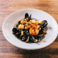 Tagliolini Neri allo Scoglio Dinner · Black squid ink pasta with seafood in a mild spicy marinara sauce.
