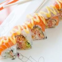I Sushi Roll · Spicy crab avocado topped with salmon fluke, red snapper with mango sauce
