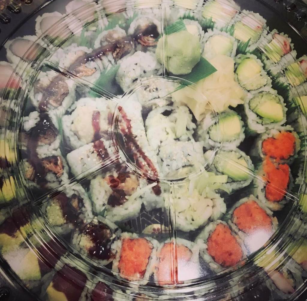 Party Sushi 3 · 2 California roll, eel cucumber, yellowtail jalapeño roll, tuna avocado roll, spicy crunchy salmon roll,Boston roll, salmon skins roll,shrimp tempura roll,avocado cucumber roll.