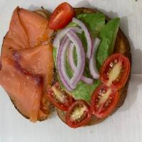 Superior Avocado Toast · Avocado On Rye Toast With Smoked Salmon, Cherry Tomatoes And Red Onions