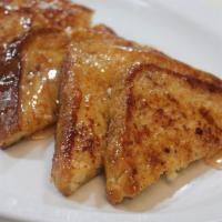 French Toast · Served with real butter and 100% pure natural syrup.