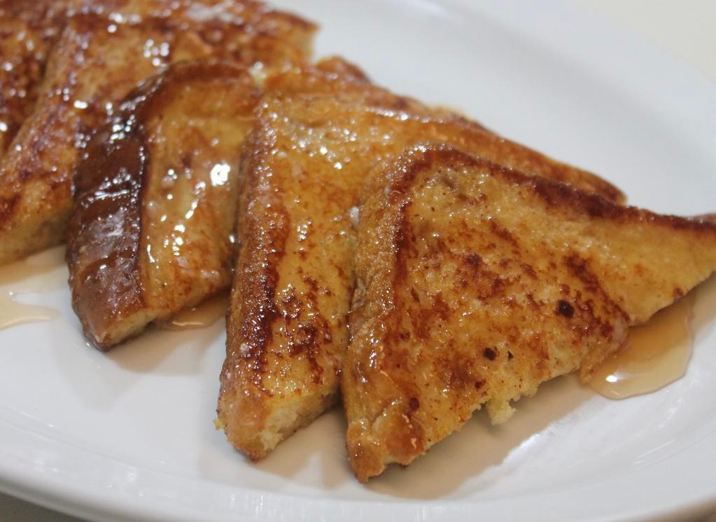 French Toast · Served with real butter and 100% pure natural syrup.