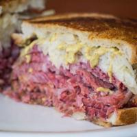  Corned Beef · stacked high with thinly cut slices of our FAMOUS Corned Beef  and served on freshly baked b...