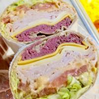 All-American Wrap · Roast Beef, Turkey, American Cheese, Lettuce, Tomatoes & Russian Dressing.