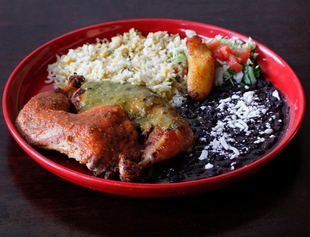 Jerk Chicken · Marinated chicken in special Jamaican jerk spice and served the traditional way with yellow rice and black beans.