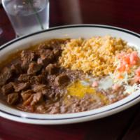 Chile Colorado · Tender cubed beef simmered in house barbacoa red sauce. Served with rice and beans and torti...