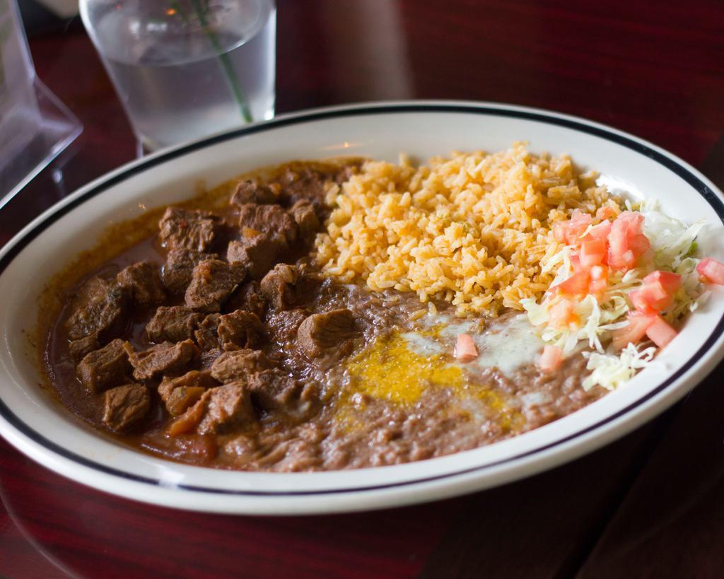 Chile Colorado · Tender cubed beef simmered in house barbacoa red sauce. Served with rice and beans and tortillas.