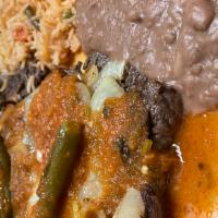 Bistec Ranchero · Beef Bistek with our Signature Ranchero Sauce comes with rice and beans With choice of corn ...