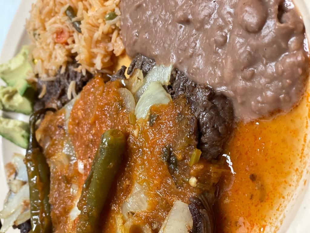 Bistec Ranchero · Beef Bistek with our Signature Ranchero Sauce comes with rice and beans With choice of corn or Flour Tortillas
