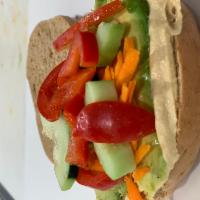 Mediterranean Bagel · Hummus On A Bagel With Avocado, Red Peppers, Carrot And Cucumbers