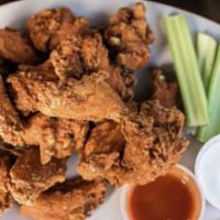 Buffalo Wings · Breaded wings with blue cheese dressing, Frank's Red Hot Sauce, and celery sticks.