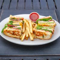 Pub Clubhouse Sandwich · Ham, turkey, Applewood bacon, Swiss, and American cheeses with lettuce and tomatoes on 3 pie...