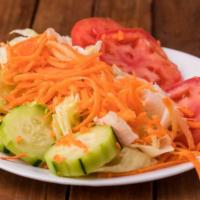 Garden Salad · Lettuce, tomatoes, cucumber and carrots. Served with garlic bread.