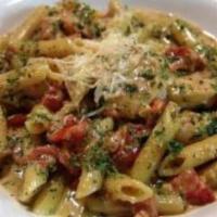 Chicken Pesto Pasta · Chicken sauteed with fresh tomato and olive oil in a creamy pesto sauce tossed in penne past...