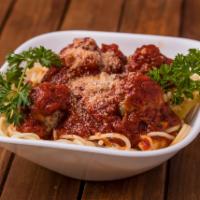 Spaghetti and Meatballs · Spaghetti topped with tomato sauce, meatballs and melted mozzarella cheese. Served with garl...