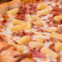 Hawaiian Pizza · Pizza sauce, Canadian bacon, ham, pineapple and extra mozzarella cheese.