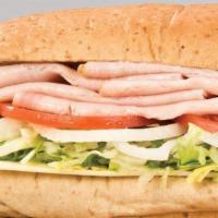 Turkey Sub · Turkey, lettuce, tomatoes, onions, mayo, sauce and melted provolone. Served with chips. Choi...