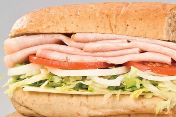 Turkey Sub · Turkey, lettuce, tomatoes, onions, mayo, sauce and melted provolone. Served with chips. Choice of bread.