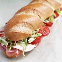 Italian Sub · Ham, salami, lettuce, tomatoes, onions, mayo, sauce and melted provolone. Served on choice o...