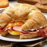 Country Style Breakfast Ham Sandwich · Ham, egg, hashbrown, bacon, on a croissant.