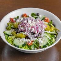 House Greek Salad · Fresh Romaine, black olives, crumbled feta cheese, fresh tomatoes, cucumbers, pepperoncini p...