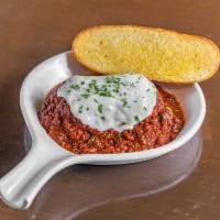 Lasagna Classic with Bolognese · Served with garlic toast.