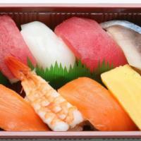 Nigiri Set · 8 pieces. 2 pieces ahi, ika, 2 pieces salmon, shrimp, egg, saba.