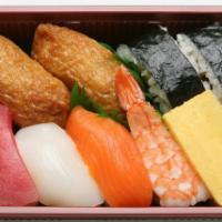 Moriawase Nigiri · 9 pieces. Ahi, ika, salmon, shrimp, egg, 2 pieces futomaki, 2 pieces inari.