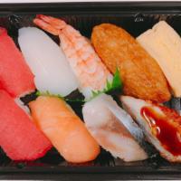 Aji Nigiri · 9 pieces. 2 pieces ahi, ika, salmon, shrimp, egg, unagi, saba, inari.