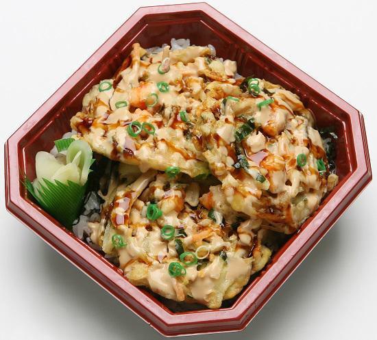 Spicy Kakiage Bowl · Kakiage (mixed vegetable tempura) 3 pieces with nori, green onions, spicy sauce and teriyaki sauce.