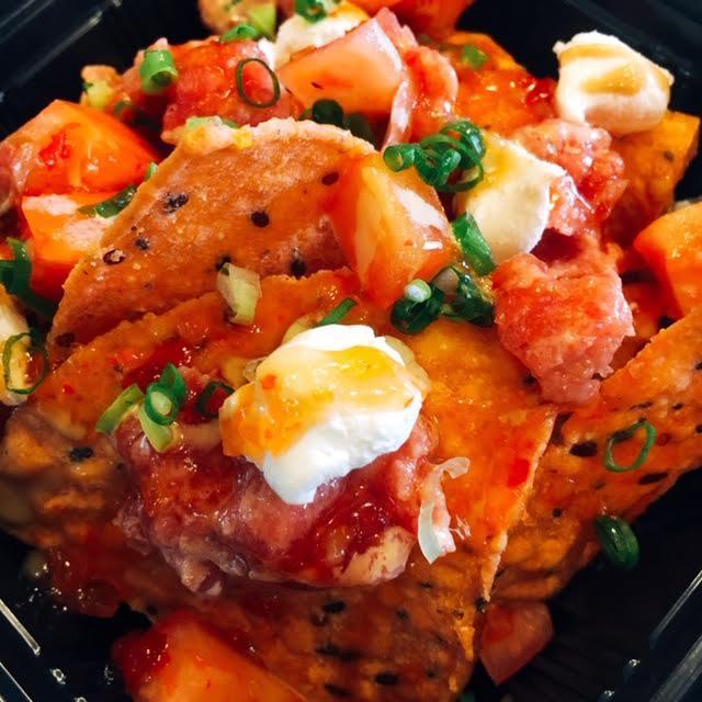 Spicy Ahi Nachos Special · Spicy ahi, organic tortillas, cream cheese, green onion, tomato, spicy sauce, sweet chili sauce.