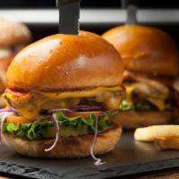 Backyard Classic Burger · Black Canyon Angus beef, cheddar cheese, lettuce, tomato, onion, dill pickles, ketchup and m...