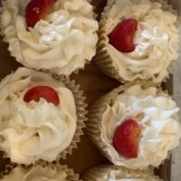 Strawberry Shortcake Cupcake · Rich Vanilla Cake- Strawberry Filled Center- Whipped Butter Cream Frosting- Strawberry on Top