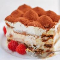 Tiramisu Portion · Layers of sponge cake soaked in coffee with powdered chocolate and mascarpone.