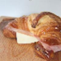 Croissant Ham & Cheese · Fresh croissant garnished with ham and cheese.
