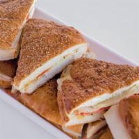 Schiacciate · Italian bread made with yeast, olive oil and flavored with herbs: Prosciutto, mozzarella and...