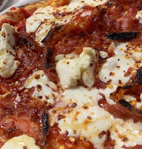 Spicy Soppressata Pizza  · Italian tomatoes, oregano, spicy soppressata, mozzarella, ricotta, and local honey. 