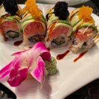 Boston Maki · Spicy tuna and avocado topped with coconut sauce and tobiko. Hot and spicy.