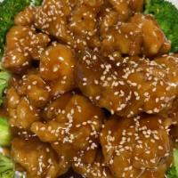 Sesame Chicken · Crunchy pieces of chicken tossed with sticky honey glaze and topped with sesame.