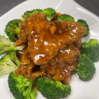 Mandarin Beef · Lightly battered beef with fresh Mandarin orange sauce. Hot and spicy.