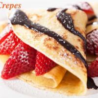 Strawberry banana nutella crepe · Homemade crepe filled with fresh strawberries and bananas, topped with nutella!
