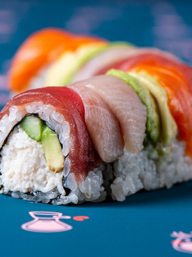 Rainbow Roll · Sushi Rice, kani kama mix, yellowtail, king salmon, ahi tuna, avocado, cucumber, sesame seeds, nori (8 pc)
