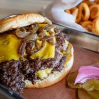 Royal Double · two brisket smash burgers, american cheese, pickles, grilled onions, smash sauce on a martin...
