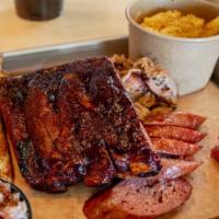 Hog Jam · three st. louis-style ribs, pulled pork, hog jam, rope sausage. served with pickles, texas t...